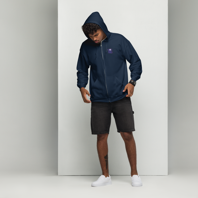 A model wearing a navy zip hoodie with the Corvid Conspiracy meeple embroidered on the left chest.