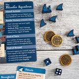Photo detailing deluxe coins and screen-printed meeples for the Bluefin Squadron