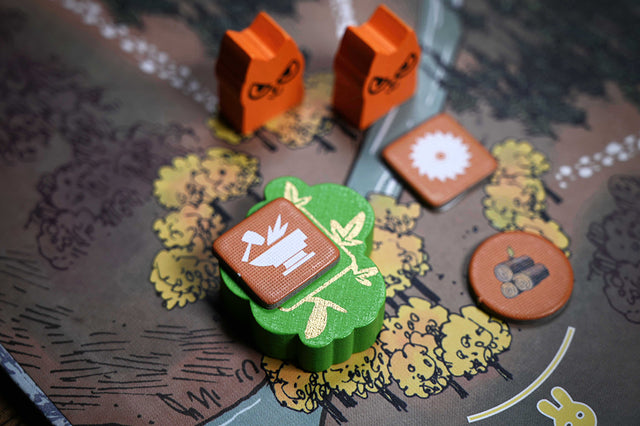 The Elder Treetop landmark in-play with a Marquise forge token atop it.